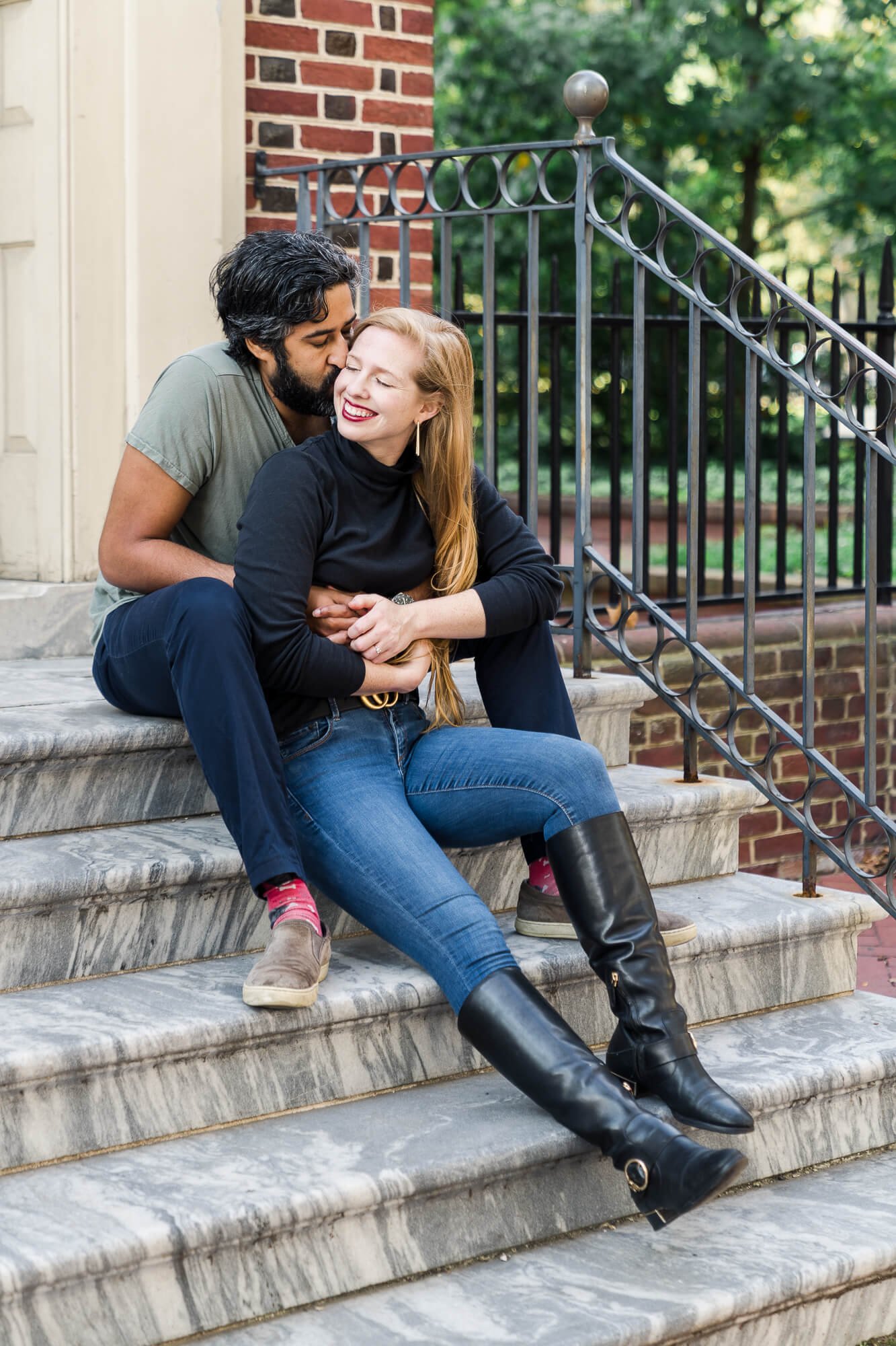 Couple sitting on marble steps in old city philly by Philadelphia engagement photographer Courtney Landrum.