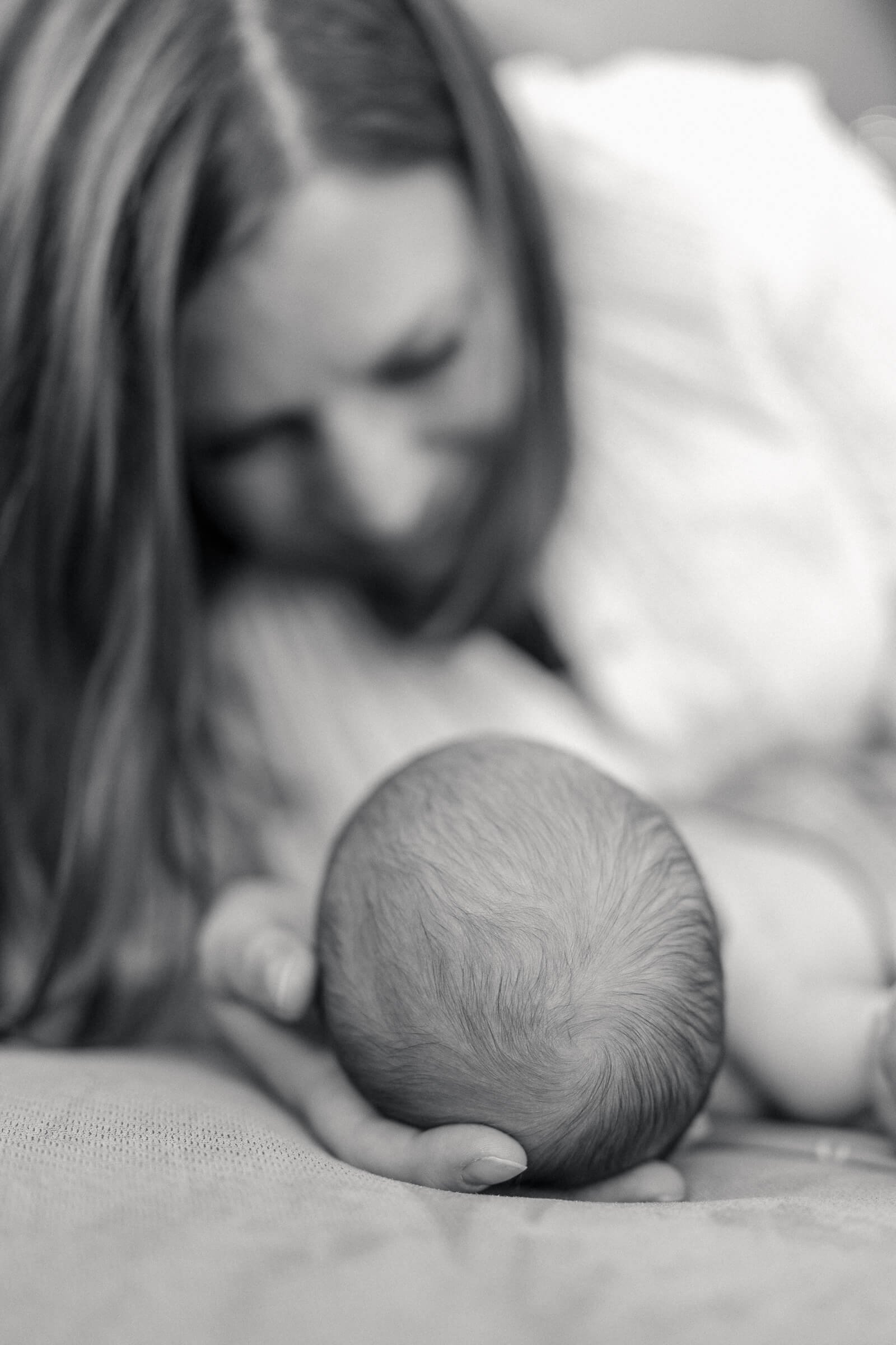 Black and white mother and newborn photo