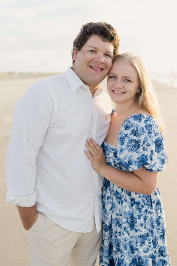 A portrait of a couple in a blue and white dress during their Ocean City, NJ engagement session.