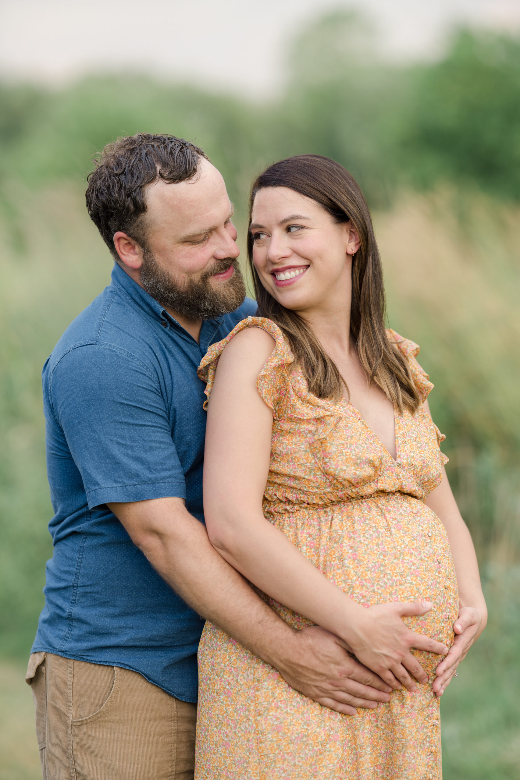 Maternity portrait of husband and wife in late summer.