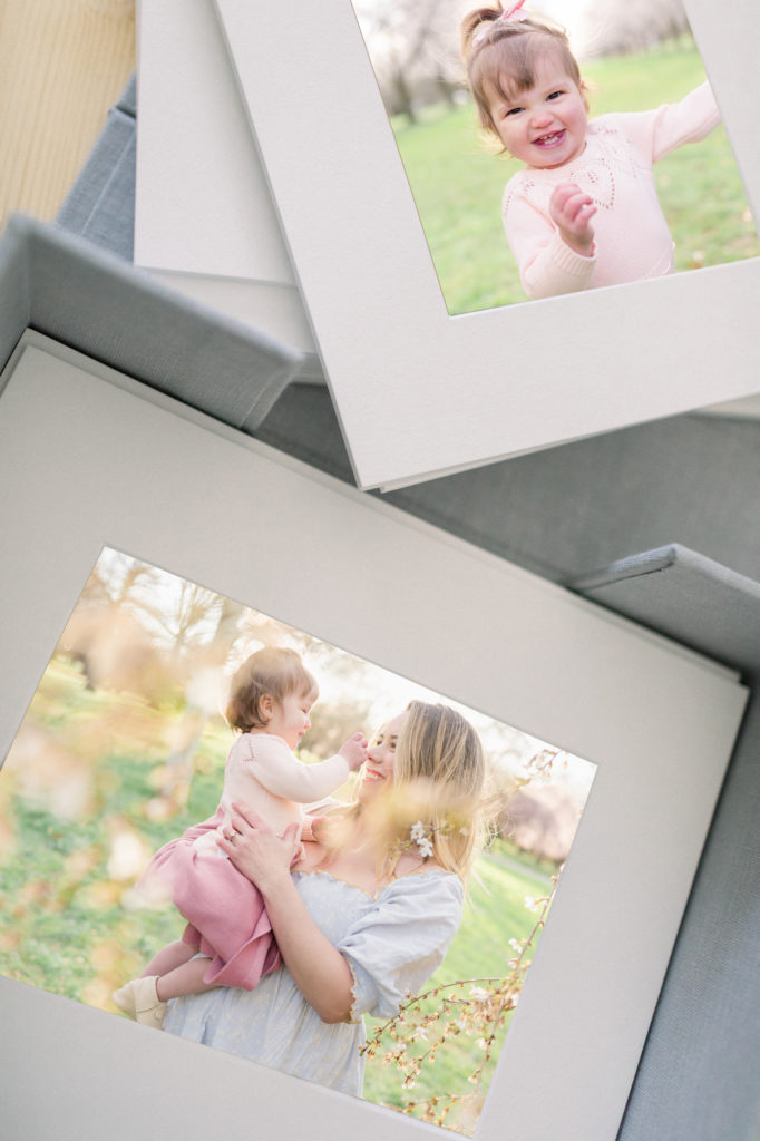 A set of loose matted prints stored in a keepsake linen box.