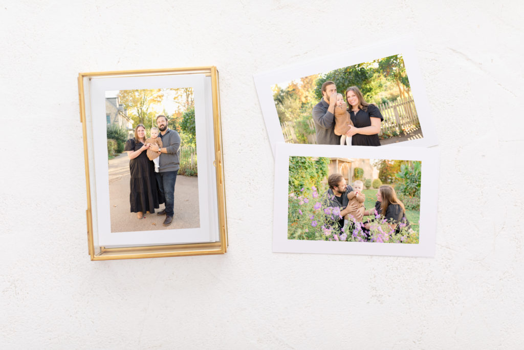 A set of proof prints stored in a glass photo box for family photo preservation.