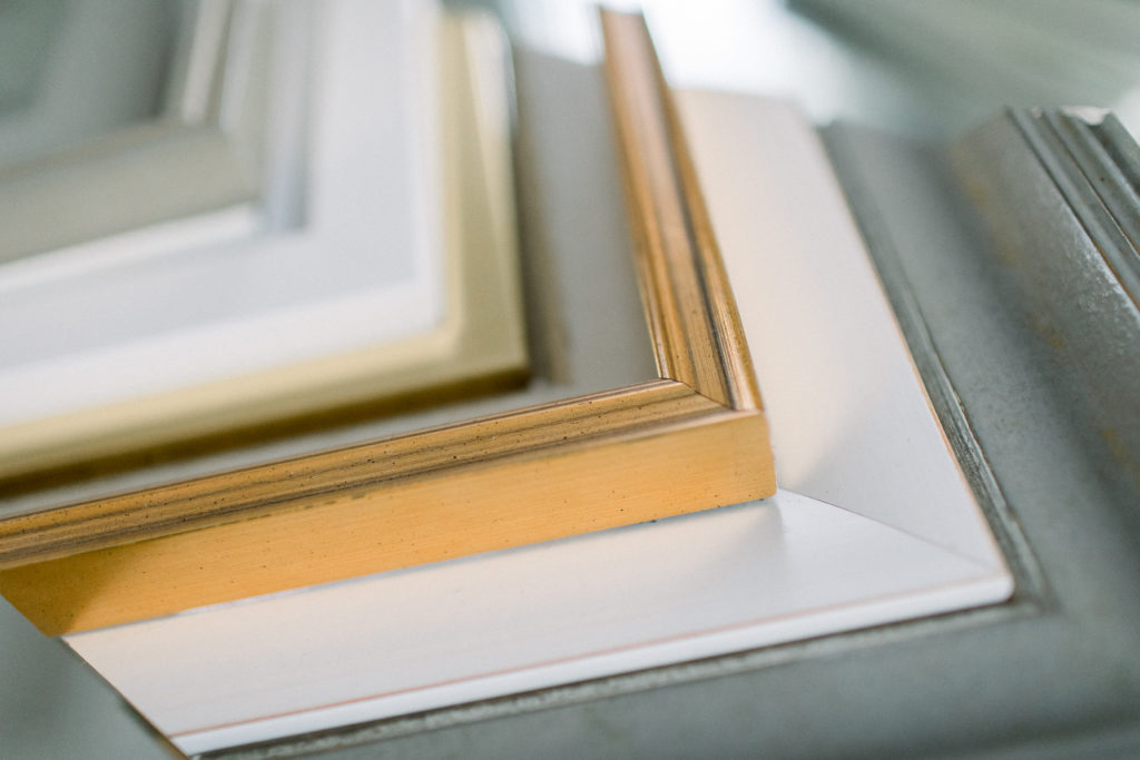 A set of fine art frames for a gallery wall, pointing to the importance of printing family photos.