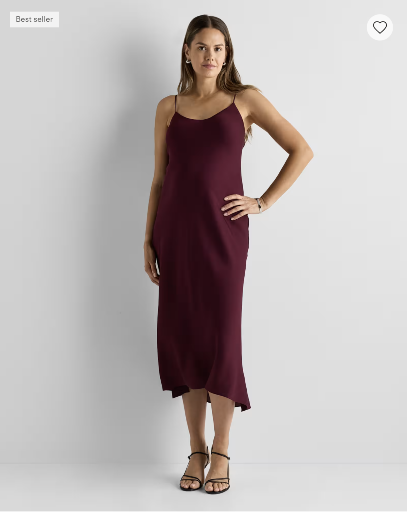 A dark red silk maternity slip dress from Quince.