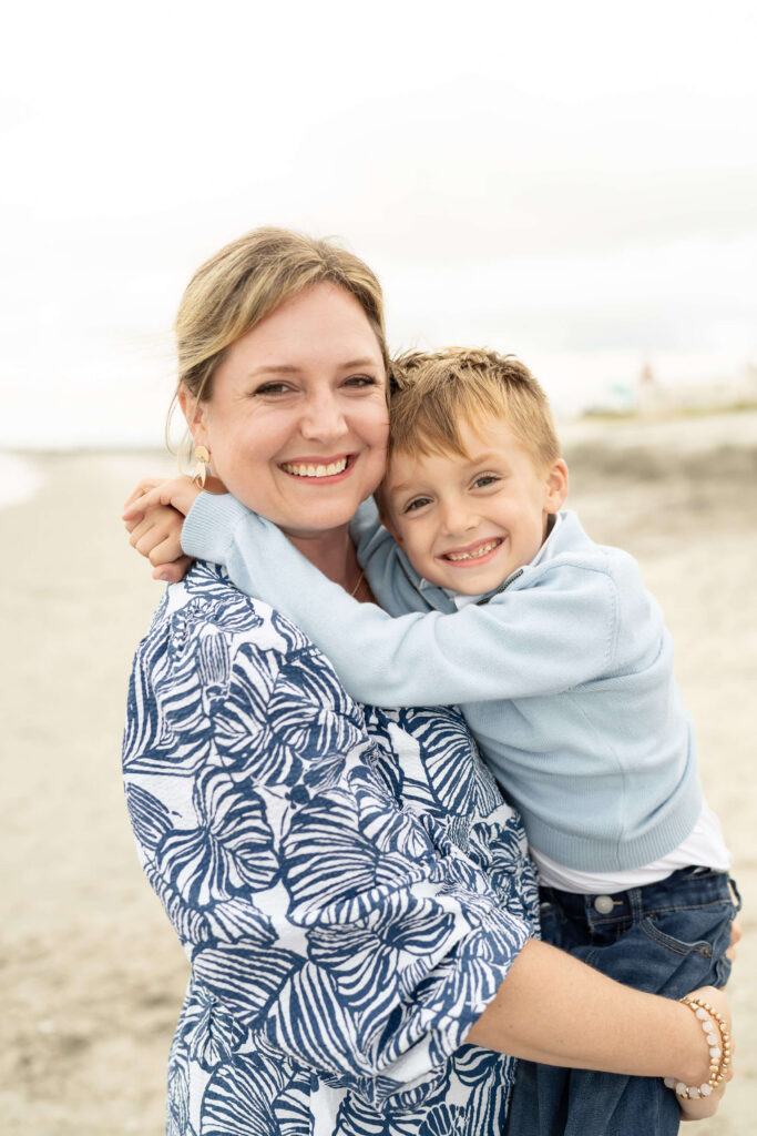 Neutral and blue summer outfits for family photos by the ocean.