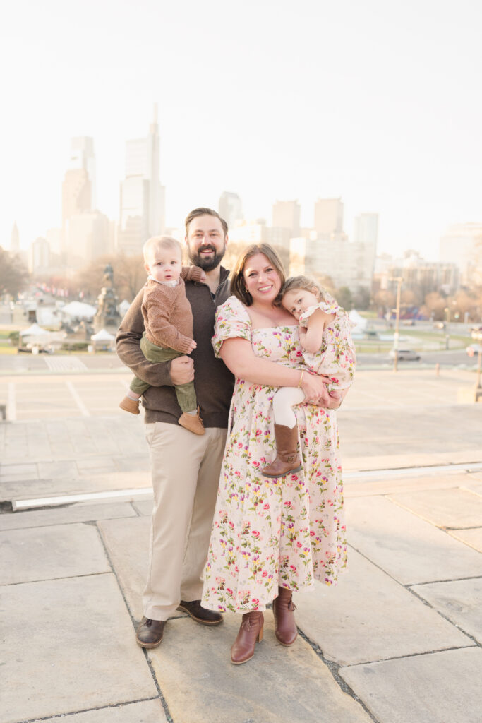 A family of four wearing floral spring dresses at the Philadelphia Art Museum.