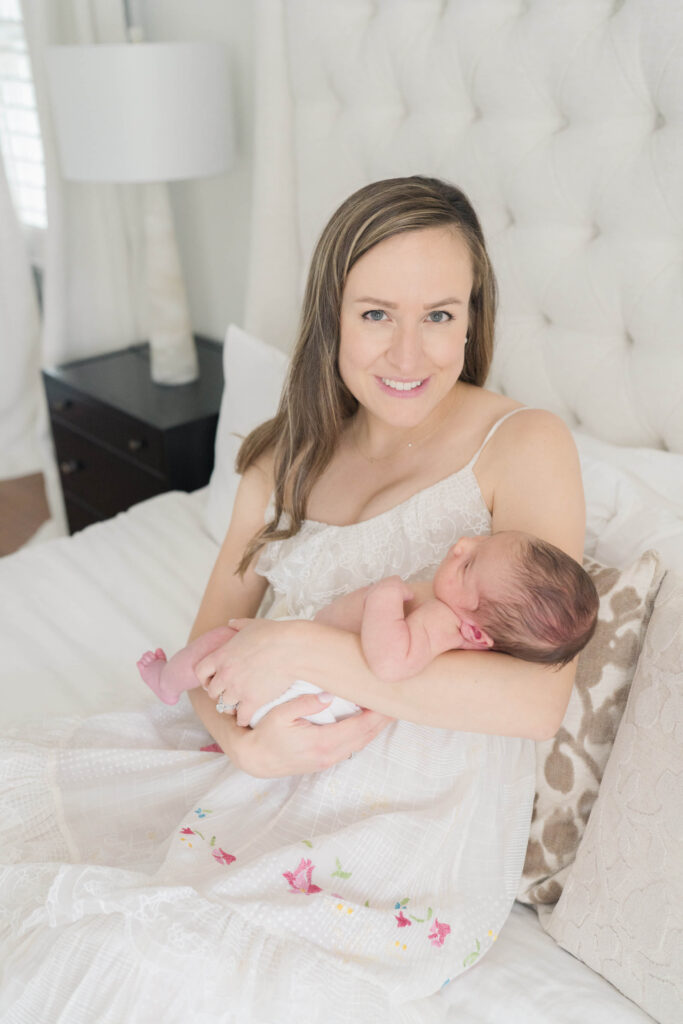 New mom enjoying quiet bonding time with her baby in their New Jersey home.