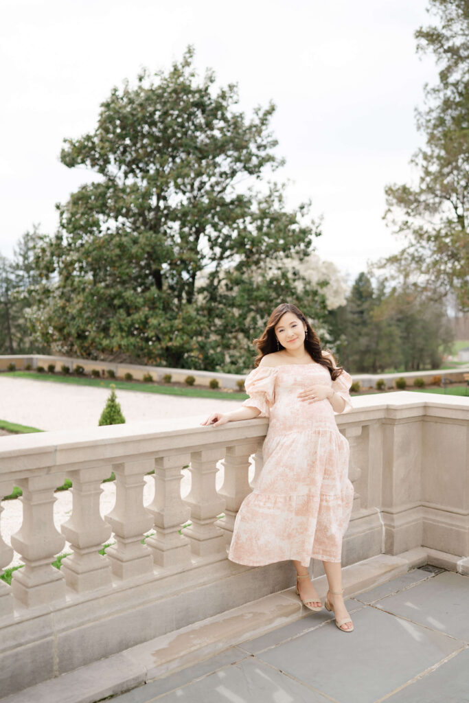 A pregnant woman beautiful spring maternity dress at Nemours Estate.