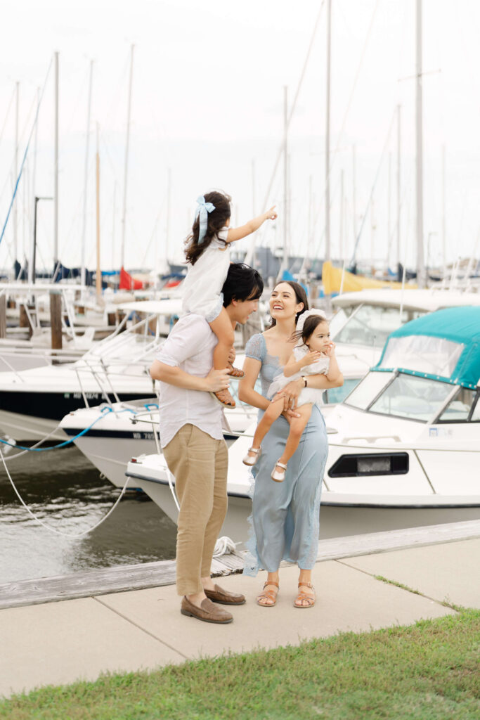 A family plays by the sailboats in Ocean City, NJ