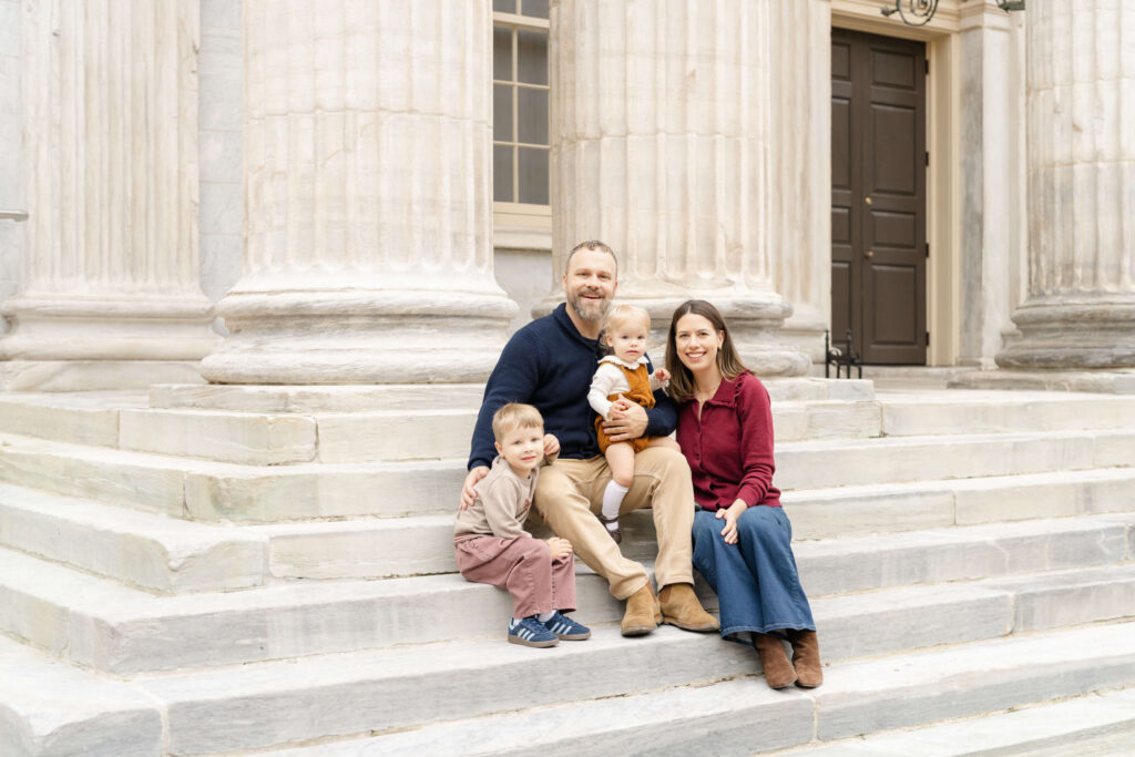 A posed portrait at the First National Bank during a fall family session in Old City.